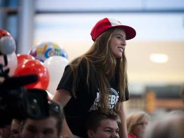 Andrea Pretty was up on shoulders to get a great view of gold medalist Erica Wiebe returning from the Olympics in Rio back to Ottawa at the Ottawa Macdonald–Cartier International Airport Tuesday August 23, 2016.