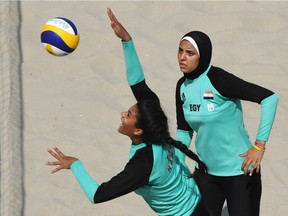 Egypt's Nada Meawad spikes the ball during the women's beach volleyball qualifying match between Italy and Egypt at the Beach Volley Arena in Rio de Janeiro on August 9, 2016, for the Rio 2016 Olympic Games. /