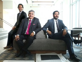 Bill Malhotra, centre, with his two sones Shawn, left, and Neil, at Claridge's new Andaz hotel in the Byward Market.