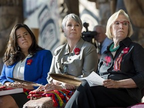 Justice Minister Jody Wilson-Raybould (left), Status of Women Minister Patty Hajdu and Indigenous Affairs Minister Carolyn Bennett listen during the announcement of the inquiry into Murdered and Missing Indigenous Women at the Museum of History in Gatineau, Quebec on Wednesday.