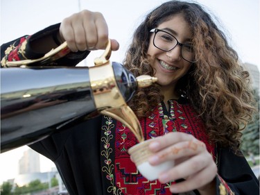 Dana Asfour pouring traditional coffee at the 3rd annual Palestinian Festival Ottawa. Friday August 26, 2016.