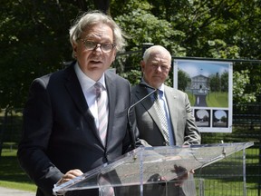 A rendering of the forecourt of Rideau Hall is seen behind Governor General David Johnston (right) as he listens to Chief Executive Officer of the National Capital Commission (NCC) Mark Kristmanson discuss the rehabilitation work to Rideau Hall ahead of the 150th anniversary of Canada's confederation, on Tuesday, Aug. 2, 2016 in Ottawa.