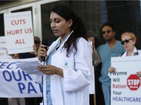 Dr. Kulvinder Gill speaks to the media at Concerned Ontario Doctors group held a rally protesting closed door negotiations between government and Ontario Medical Association walking from Queen's Park up to the OMA office on Bloor street on Friday July 22, 2016.