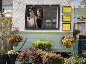 Dumpling Park owner Krista O'Leary, left, and her business partner Kellie Vu at their trailer hidden behind Morning Owl coffee shop on Rochester Street.