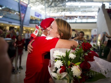 Erica Wiebe greets her family and friends after returning from the Olympics in Rio to Ottawa at the Ottawa Macdonald–Cartier International Airport Tuesday August 23, 2016.