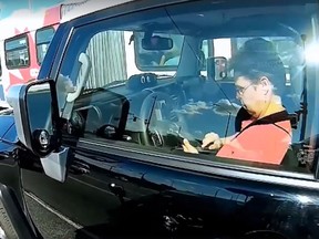 A helmet-cam video shot last Friday of a confrontation between an Ottawa motorcyclist and a distracted SUV driver has gone viral.