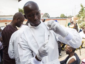 A health worker prepares the Canadian Ebola vaccine.