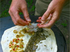 Ahmad Altaouil whips up his famous Syrian pizzas for folks in his new home- Wakefield.