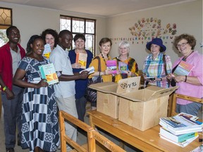 From-    Mah- Alison To-      Photo Subject- city Sent-    Monday- August 22- 2016 1-43 PM  Arlene McKechnie -far right-- TEMBO board members and "Traveling with TEMBO" participants deliver textbooks to the TEMBO-built Orbomba Library. -Photo by Jane Spencer-   Ottawa Citizen Photo Email