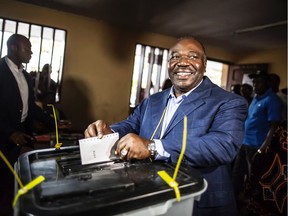 Gabonese President Ali Bongo Ondimba arrives to cast his vote at a polling station during the presidential election on Saturday, Aug. 27, 2016 in Libreville.