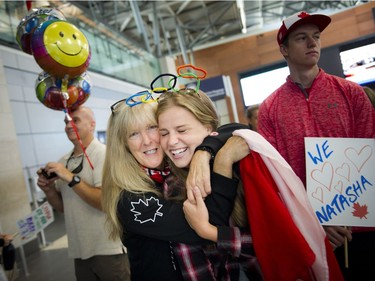 Gatineau's Natasha Watcham-Roy was welcomed home at the Ottawa Macdonald–Cartier International Airport with her bronze medal Tuesday August 23, 2016. Natasha's mother Kathryn Watcham gives Samantha Yost a big squeeze just before Natasha arrived.