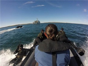 Pathfinders from Royal 22e Régiment, Valcartier Quebec, jump into the waters of Rankin Inlet Nunavut, during Operation NANOOK 2016, August 24, 2016. 

Photo: Lt(N) Andrea Murray
YK-2016-072-005