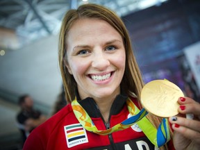 Gold medallist Erica Wiebe was greeted by family, friends and supporters after returning from the Olympics in Rio.