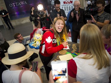 Gold medalist Erica Wiebe was greeted by family, friends and supporters after returning from the Olympics in Rio to the Ottawa Macdonald–Cartier International Airport Tuesday August 23, 2016.