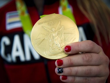 Gold medalist Erica Wiebe was greeted by family, friends and supporters after returning from the Olympics in Rio to the Ottawa Macdonald–Cartier International Airport Tuesday August 23, 2016.