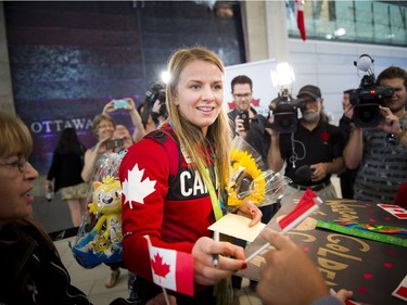 Gold medalist Erica Wiebe was greeted by family, friends and supporters after returning from the Olympics in Rio to the Ottawa Macdonald–Cartier International Airport Tuesday August 23, 2016.