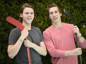 Hockey brothers Samuel, left, and William Bitten, right, are photographed in their backyard in Ottawa Wednesday June 15, 2016. William is about to be drafted into the NHL, after a rough season playing in Flint, MI while his brother, Samuel, was just drafted by the Ottawa 67s.