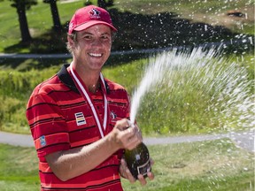 Hugo Bernard from Mont-Saint-Hillaire, Quebec celebrates  with some champagne after winning the 112th Canadian Men's Amateur Championship with a final round 5 under par 65 at The Royal Ottawa Golf Club to finish the tournament at -11. Thursday August 11, 2016.