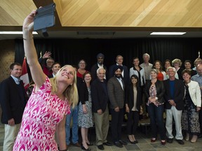 Environment Minister Catherine McKenna takes a group selfie at a Liberal cabinet retreat in Sudbury Aug. 21.