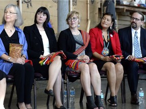 From left, commissioners Marion Buller, Qajaq Robinson, Marilyn Poitras, Michele Audette and Brian Eyolfson listen during the announcement of the inquiry into Murdered and Missing Indigenous Women at the Museum of History in Gatineau on Wednesday. The federal government has announced the terms of a long-awaited inquiry into murdered and missing indigenous women, unveiling that it will need at least $13.8 million more for the study than was originally expected.