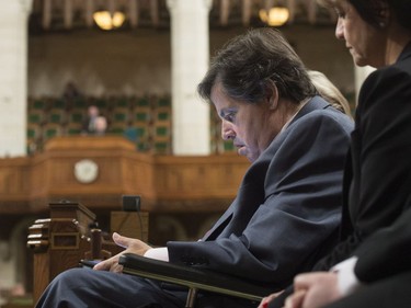Member of Parliament for Ottawa-Vanier Mauril Belanger, who lives with ALS (also known as Lou Gherig's disease), uses a tablet with text-to-speech program to defend his proposed changes to neutralize gender in the lyrics to "O Canada" in the House of Commons on Parliament Hill in Ottawa on Friday, May 6, 2016.