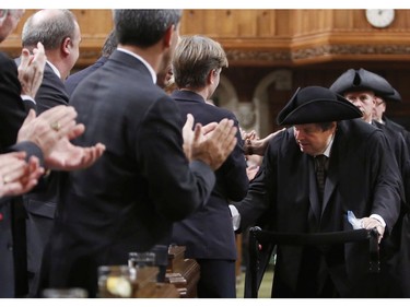 Liberal MP Mauril Belanger is given a standing ovation as he makes his way to the Speaker's Chair in the House of Commons Ottawa to preside over the House of Commons Wednesday, serving as honorary Speaker in a tribute organized by his fellow MPs following his diagnosis with ALS last November, in Ottawa Wednesday March 9, 2016.