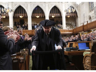 Liberal MP Mauril Belanger is given a standing ovation as he makes his way to the Speaker's Chair in the House of Commons Ottawa to preside over the House of Commons Wednesday, serving as honorary Speaker in a tribute organized by his fellow MPs following his diagnosis with ALS last November, in Ottawa Wednesday March 9, 2016.