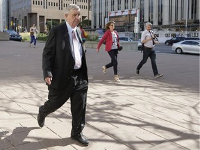 Michael Beaton, a chiropractor found guilty of indecent and sexual assault on three male patients, leaves the Ottawa courthouse on Monday.