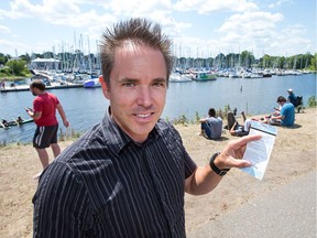Miles Hammond is a member of the Nepean Sailing Club who received a parking ticket for parking on the grass at Dick Bell Park on Monday. Members of the club and Pokémon Go players, seen here in the background, have been competing for parking spots at the park, which has been a popular spot for catching Pokemon.