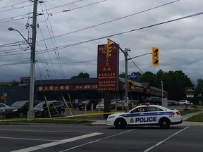 A police cruiser sits at the scene of a shooting incident near Overbrook on Sunday, Aug. 14, 2016.