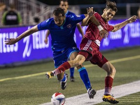 Ottawa Fury FC Maxim Tissot battles with Miami FC Pablo Campos during first half NASL action at TD Place in Ottawa on Wednesday August 24, 2016. Errol McGihon/Postmedia