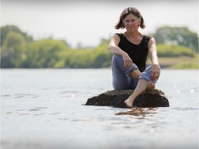 Ottawa Riverkeeper Meredith Brown, pauses for a portrait near the Remic Rapids in the Ottawa river June 20, 2016. Brown helps reconnect capital residents with the river. Ottawa Citizen photo by Jason Ransom
