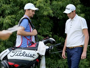 Ottawa Senators player Mark Stone (left) was caddying for his pal, Matt Hill (right), during the opening rounds of the National Capital Open to Support Our Troops, held Thursday at the Hylands Golf and Country Club in Ottawa.