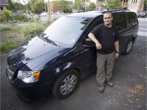 Paul Charette, a locksmith with First Choice Locksmith whose van plummeted into the Rideau St. sinkhole in June, stands by his new ride.