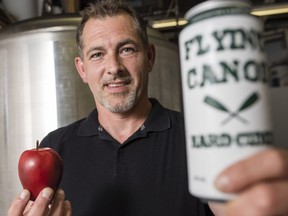 Pete Rainville, founder of Flying Canoe Hard Cider, is photographed in his manufacturing facility in Ottawa Monday, August 15, 2016.