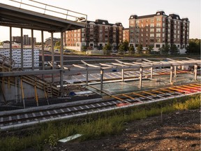 The city is adding "enhancements" to the existing $2.1-billion LRT contract, costing millions more.