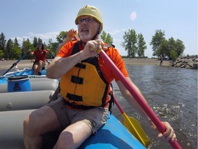 Don Butler paddles his way along the Ottawa River during a city rafting tour.