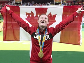 Canada's Rosie MacLennan, from King City, Ont., celebrates after winning gold.