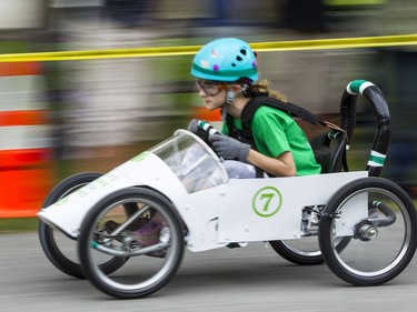 Savannah Leduc is blurred as she zooms down Beaverwood Rd. during the 6th Annual Soapbox Derby in Manotick Sunday, August 28, 2016.