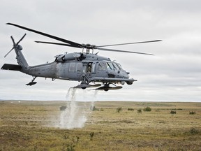 An HH-60 Pave Hawk helicopter from the 210th Rescue Squadron takes off from the tundra after loading simulated casualties during exercise Arctic Chinook, near Kotzebue, Alaska, August 24. Arctic Chinook is a joint U.S. Coast Guard and U.S. Northern Command sponsored exercise which focuses on multinational search and rescue readiness to respond to a mass rescue operation requirement in the Arctic. (U.S. Air National Guard photo by Staff Sgt, Edward Eagerton/released)