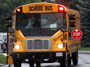 High school students board a school bus in Barrhaven.