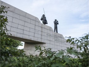 The Peacekeeping Monument, background, is photographed in Ottawa Monday, August 15, 2016, just one of the things you may see on a walk along MacKenzie Ave. from the Chateau Laurier to the Peacekeeping Monument.   (Darren Brown/Postmedia)