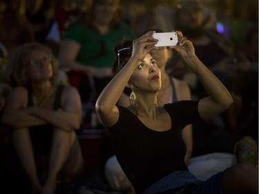 The Tragically Hip's final concert that took place in Kingston was projected in Parkdale Park for a large crowd of fans, including Kelsey Rideout who was taking photos at the beginning of the show.
