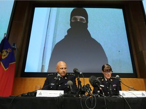 Royal Canadian Mounted Police Assistant Commissioner Mike Cabana and Assistant Commander for Ontario, Jennifer Strach speak during a press conference at the RCMP National Headquarters in Ottawa on Aug. 11.