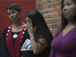 Lorelei Williams wipes a tear from her eye during a news conference on Missing and Murdered Indigenous Women and girls in Vancouver, B.C., Wednesday, August, 3, 2016.