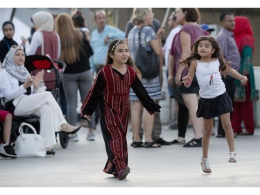 Young girls dancing as singer Nisreem Hajaj performs at the 3rd annual Palestinian Festival Ottawa. Friday August 26, 2016.