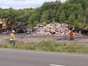 The aftermath of a transport truck and stationary safety truck collision on Highway 401 about three kilometres west of Reynolds Road in Leeds and the Thousand Islands Township on Wednesday September 14, 2016.