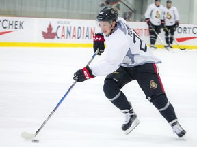 Matt Puempel skates up ice with the puck during the Ottawa Senators' practice at the Bell Sensplex on Saturday, Sept. 24, 2016.