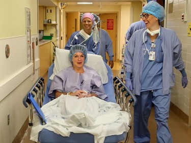 7:27 a.m. (Minnesota time). Tina Boileau jokes with the nurses en route to the OR, where surgeons will remove bone marrow - rich in the stem cells - from her hip bone at the University of Minnesota Masonic Children's Hospital Thursday (Sept. 8, 2016).