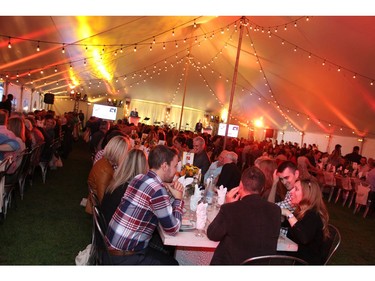 A crowd of 450 dined elbow-to-elbow inside the giant party tent during the Queensway Carleton Hospital's 40 Years of Love anniversary gala, held at Saunders Farm on Friday, Sept. 16, 2016.